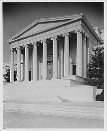 The image shows a classic architectural structure with tall, white columns and steps leading up to the entrance. The building appears to be made of stone or another light-colored material, giving it an imposing presence. There is no visible signage indicating what type of institution it may represent.
Horydczak was born around 1890-1971, but there's limited information available about him in the provided text. The image has a National Gallery reference suggesting that this could be related to artworks from or associated with such an establishment. However, without further context, it is difficult to determine any specific details regarding Horydczak’s connection to the art gallery.
1 negative : safety ; 8 x 10 in