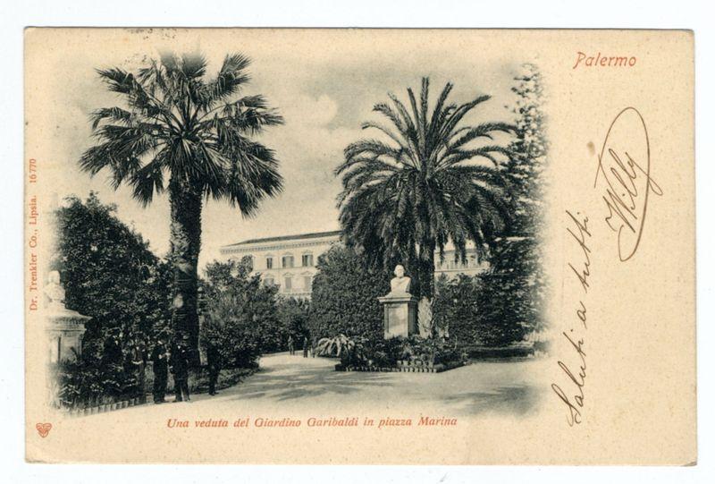 The image depicts a vintage postcard, labeled "Palermo" at the top right corner. It features an old photograph printed on off-white paper with red and black text annotations around it. The central visual is of Giardino Garibaldi in Piazza Marina, as indicated by the caption below the photo which translates to English from Italian: "A view of Giardino Garibaldi located at Marin Square." This garden appears lush with palm trees, manicured bushes, and a statue on a pedestal. The buildings suggest an institutional or governmental setting in the background.

There's handwriting that reads "Salita a bordo" which means "Boarding" from Italian language to English translation suggesting this may have been part of some event but it seems quite faded now so might not be legible anymore clearly, maybe there was something written on here. The postcard has a red circular logo with an image inside the circle and also contains other texts including a name 'Dr. Treinkler Co., Lipsia' at the left bottom corner indicating where this photo print is possibly made from.

The overall setting seems serene and historical given its vintage appearance, which might be part of Palermo's rich cultural history or landmarks related to Giuseppe Garibaldi as he was an Italian general, patriot, and statesman.