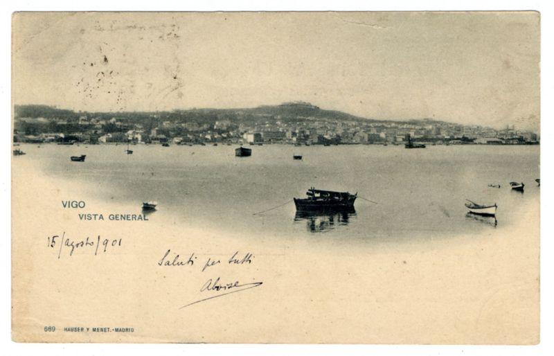 The image depicts a vintage black and white photograph of the harbor area in Vigo, Spain. It features several boats floating calmly on water with land visible across the horizon, including buildings and possibly some hills or mountains in the background. The sky appears overcast.

Text is present at the top right corner which reads "VIGO / VISTA GENERAL," indicating that this photo captures a general view of Vigo. Below it, there are handwritten inscriptions: on the left side, dates written as '15/ago/90', and in the center-right section, a message begins with "Saluti per tutti" followed by an illegible signature.

At the bottom right corner is another text line stating "HAUSER Y MENET -MADRID." This likely indicates either the photographer or the publishing house responsible for this photograph. The image appears to be aged and has some visible wear, such as creases and discolorations.