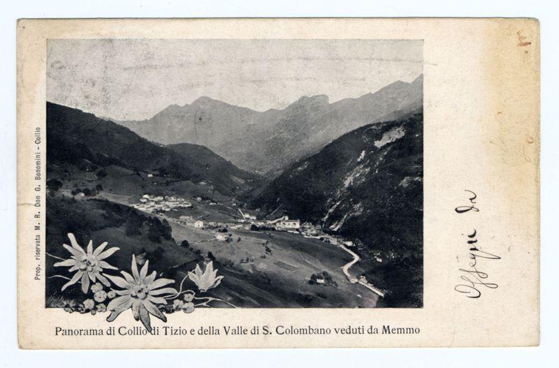 The image is a monochrome photograph showcasing an aerial view of the Collio region, highlighting its picturesque landscape. The foreground features flowers that add to the scene's natural beauty and contrast with the rugged terrain in the background. These mountains appear majestic against the sky line, giving depth to the picture.

A winding road snakes through the valley below, connecting various patches of land scattered throughout this rural area. It is likely a historical photo given its vintage aesthetic—a black-and-white image on paper with signs of aging such as creases and some discoloration. The photograph's borders are framed by printed text that reads "Panorama di Collio Tizio e della Valle di S. Colombano veduti da Memmo," attributing the work to Bonomini-Golfo, a professional photographer or artist associated with this scenic area.

Additional context can be found on an online resource indicating it is part of the Memmo (Collio) collection—specifically mentioning 'Panorama di Collio Tizio e della Valle di S. Colombano veduti da Memmo.' This reference suggests further information about the photograph's historical and artistic significance could likely be explored through this link or similar sources detailing its provenance, creator, and possibly other works by Bonomini-Golfo within the region of Collio (Golfo).