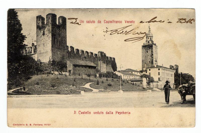 The image is a sepia-toned postcard featuring an old photograph of Castel San Pietro in Castelfranco Veneto, Italy. The castle's ruins are prominently displayed with two tall towers and remnants of walls that suggest historical significance. In the foreground, there is a person walking beside a cart loaded with goods on one side and a path leading towards the right edge where more buildings can be seen. Handwritten signatures in red ink adorn the top left corner and bottom center, adding a personal touch to the postcard. At the forefront of the image, text states "Il Castello veduto dalla Peschiera," indicating that the castle is viewed from the fish market area. The overall aesthetic suggests this was likely used for communication during an earlier time period when such cards were prevalent.