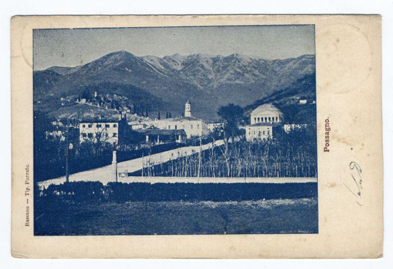 The image is a vintage postcard featuring an old photograph. The scene depicted in the photo appears to be taken from a distance, showing a landscape with buildings and mountains in the background. A prominent building resembling a church or public institution stands out at the center of the composition.

In the foreground, there's a well-maintained garden area leading up to what seems like steps that lead toward one of the structures within the complex. The sky is overcast, casting an even light across the scene without strong shadows. On the right side of the photograph, in script handwriting, "Possagno" is written, indicating either the name of the place or artist who created this piece.

The postcard has visible signs of aging and wear, such as some creases at the top edge where it seems to be slightly folded back over time. The overall color tone leans towards blue-gray due to its age, possibly from a process like albumen printing often used in photography during that era.

