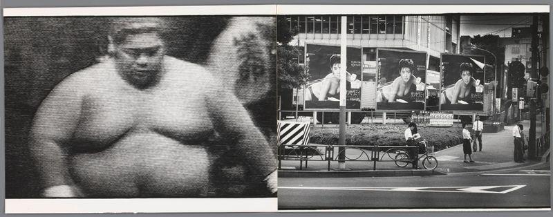 This image displays a split composition divided into two distinct sections. On the left side, there is an up-close black and white photograph of what appears to be a muscular torso with arms bent at the elbows in a flexing position. The texture suggests muscle definition, indicating physical strength or athleticism.

On the right side, we see a street scene captured in monochrome photography which depicts various elements indicative of urban life during that era. In this section, there are large billboards featuring images and Japanese text prominently displayed on an outdoor advertising board. These billboards appear to be promoting entertainment content related to sumo wrestling or other sports.

In the foreground of this part of the image, we can observe a street scene with pedestrians walking along sidewalks. One individual is seen pushing a handcart filled with items which might suggest they are selling goods such as newspapers, snacks, or flowers typically found on Japanese s