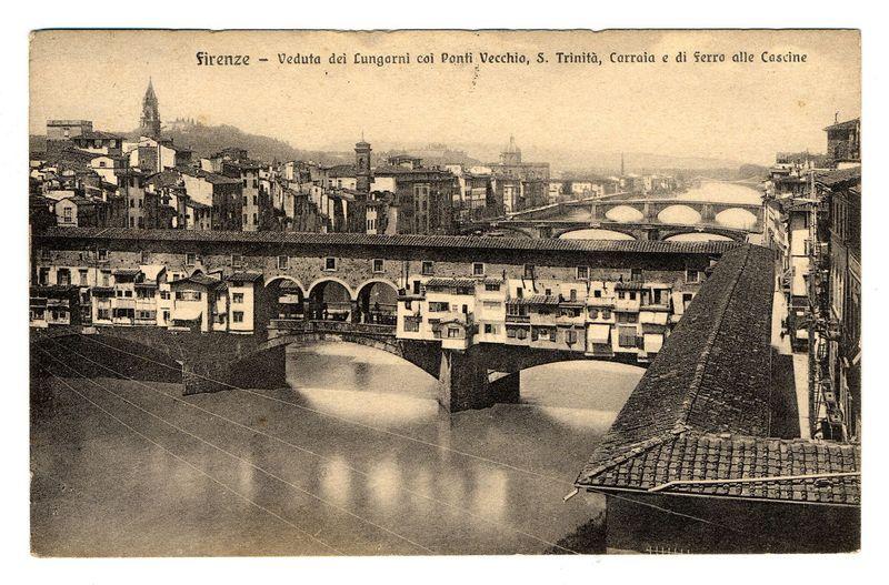 The image is a sepia-toned historical photograph depicting the cityscape of Florence, Italy. It features prominent views across its historic bridges known as Lungarni over the Arno River including Ponte Vecchio (Old Bridge), S. Trinita', and Carraia with additional bridge named Di Ferro alle Cascine in the foreground. The vantage point appears to be from a high angle, overlooking rows of traditional Florentine architecture lining the riverbanks on either side.

The buildings are densely packed, showcasing classic European architectural styles such as mansard roofs, arched windows, and varied heights which suggest different historical periods. Notably, there is a prominent tower in the background that rises above other structures, adding to Florence's iconic skyline.

In terms of composition, it captures not only the urban environment but also reflects on its historical significance through architectural preservation amidst natural elements like water bodies. This photograph likely 