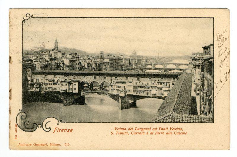 The image depicts a vintage postcard featuring the historic cityscape of Florence, Italy. It showcases an old black-and-white photograph with handwritten annotations on its right side and decorative borders at the top left corner. The central focus is the Ponte Vecchio bridge crossing over the Arno River. A collection of medieval-style buildings line both sides of the riverbank.

The postcard includes text in Italian, which translates to "Florence - View from the Lungarni with Old Bridges: Santa Maria Novella Bridge, Trinity Chapel, Carraia and Iron Bridge at Cascine." The photographer's name is credited as 'Amilcare Guarnieri,' Milan. It appears dated, suggesting it was taken several decades ago.

The handwritten annotations appear to be in Italian, possibly indicating the date or personal notes from a previous owner. There are visible creases on the paper and wear marks indicative of age and handling over time.