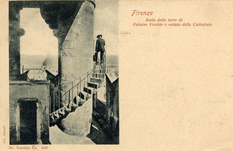 The image shows a vintage postcard featuring an old photograph of Florence, Italy. It depicts the Scala della torre di Palazzo Vecchio e veduta della Cattedrale (the stairs to the tower of Palazzo Vecchio and view of the Cathedral), as indicated by text at the top right corner. A man stands on one of these historic stone steps leading up a large tower structure, with his back towards the camera; he appears contemplative or waiting while looking out over the cityscape.

The surrounding area includes architectural elements like stonework that suggests an older European building setting. The background reveals part of Florence's famous dome, hinting at its proximity to landmarks such as Giotto's Bell Tower and perhaps Santa Maria del Fiore, commonly known as the Duomo di Firenze (Florence Cathedral).

The postcard has a textured appearance with signs of age or wear, consistent with historical artifacts. It is credited to Dr. Trenkler Co., 4427 at the bottom left corner.

This image 